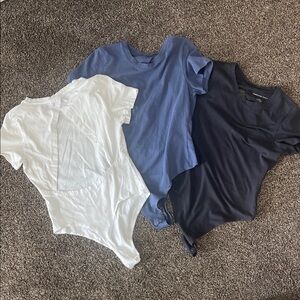 Set of Three Short Sleeve Bodysuits in White, Blue, and Navy